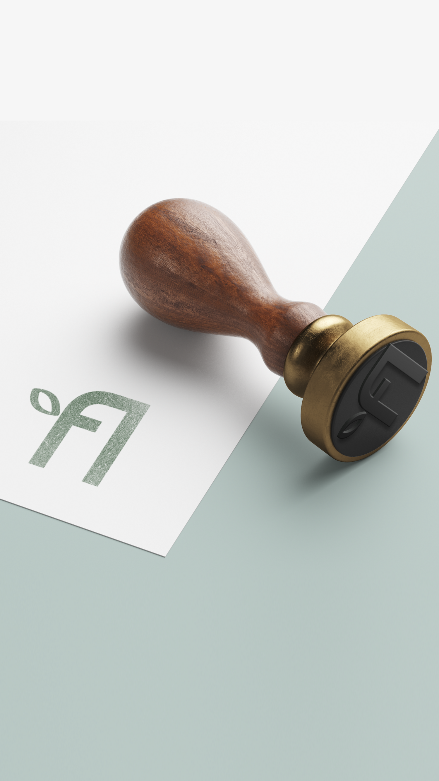 Wax seal with wooden handle and brass stamp with Floyd Accounting Logo on a light green background